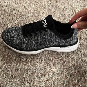 APL black and white tennis shoes